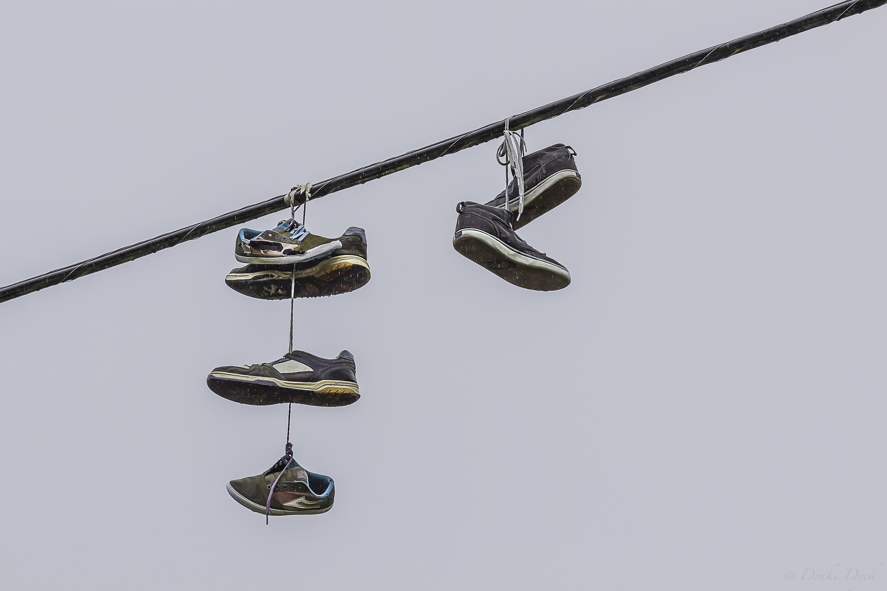 multiple shoes caught up on power wires