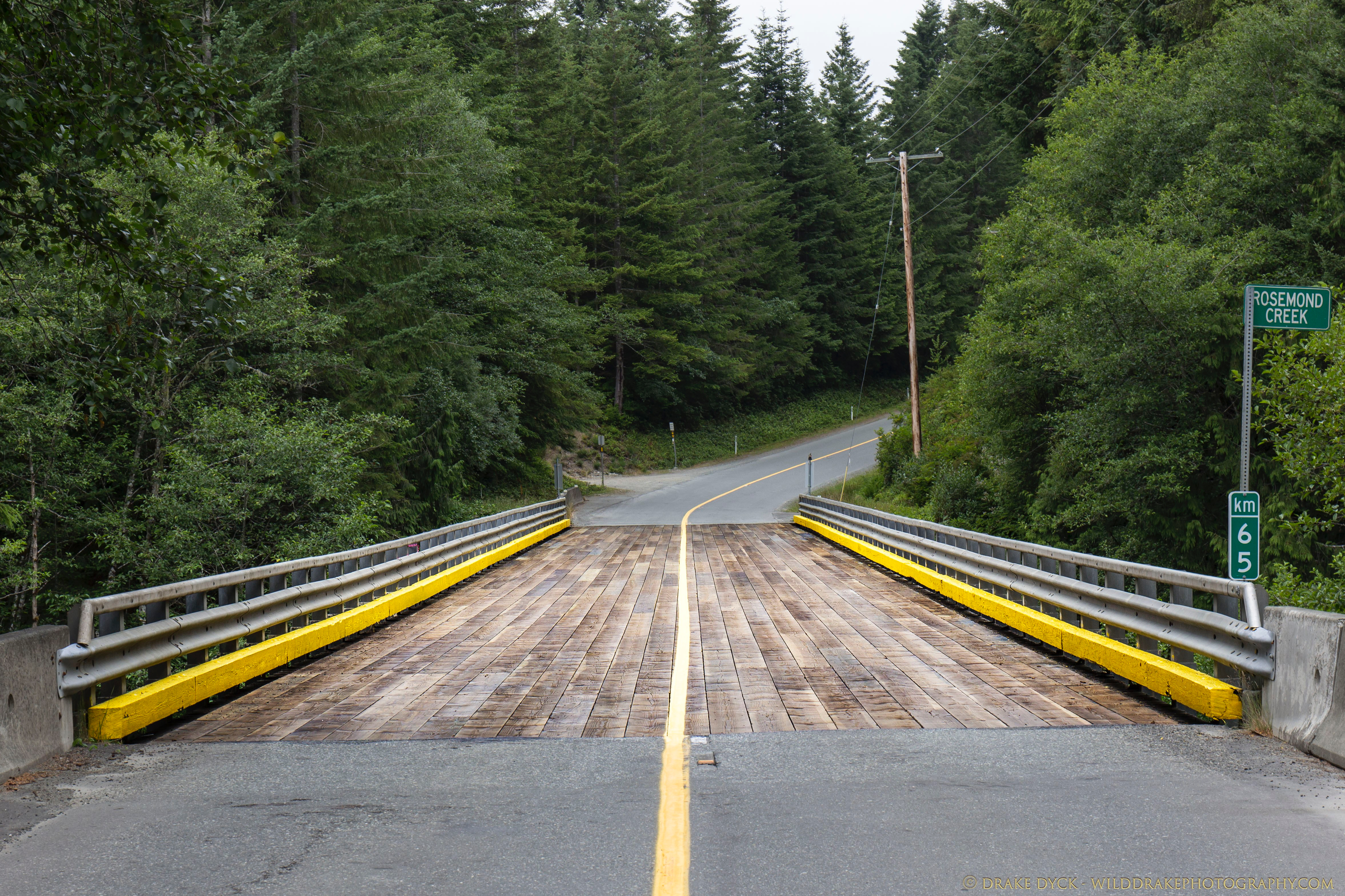 a wood plank bridge crosses Rosemond Creek