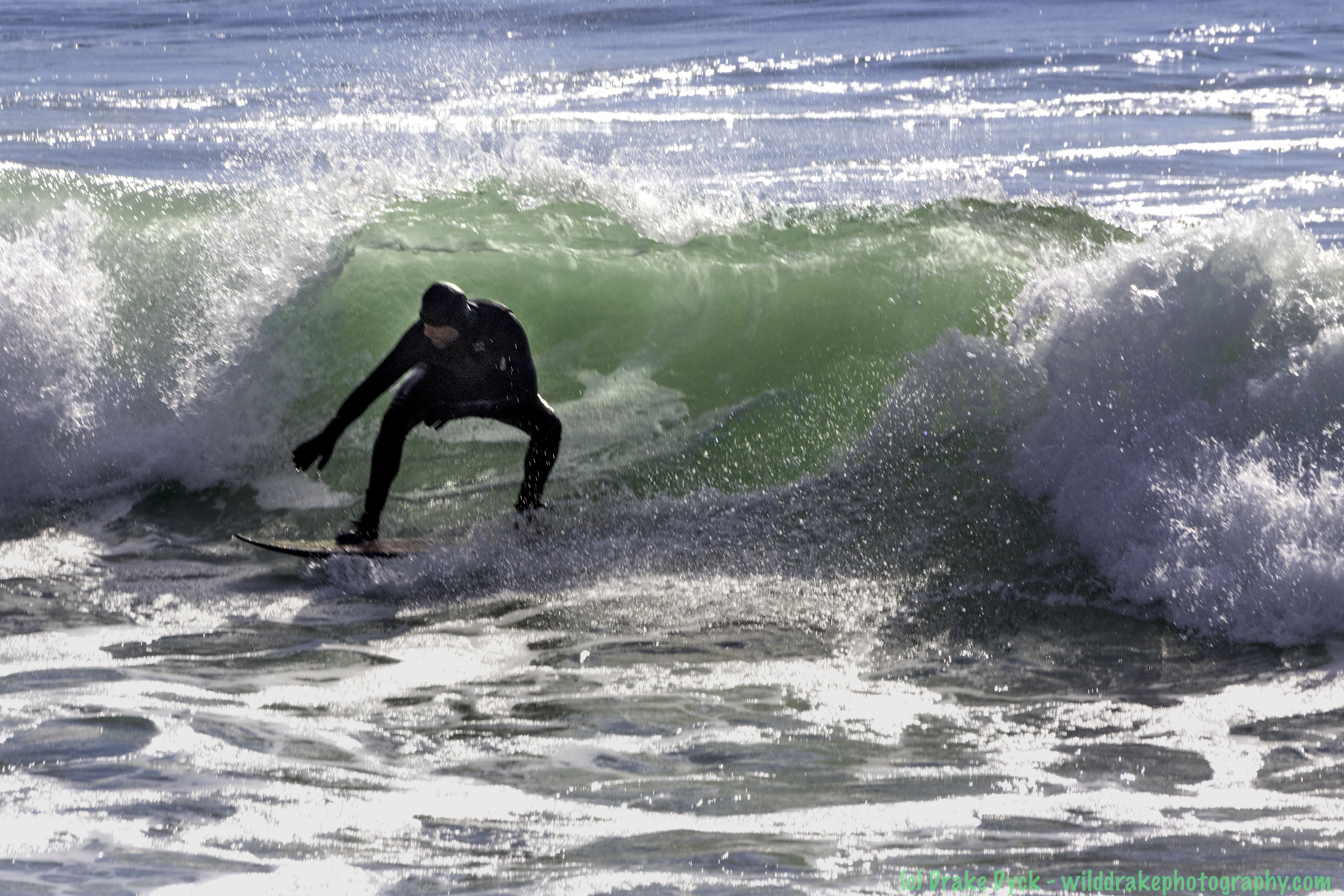 a surfer rides the waves