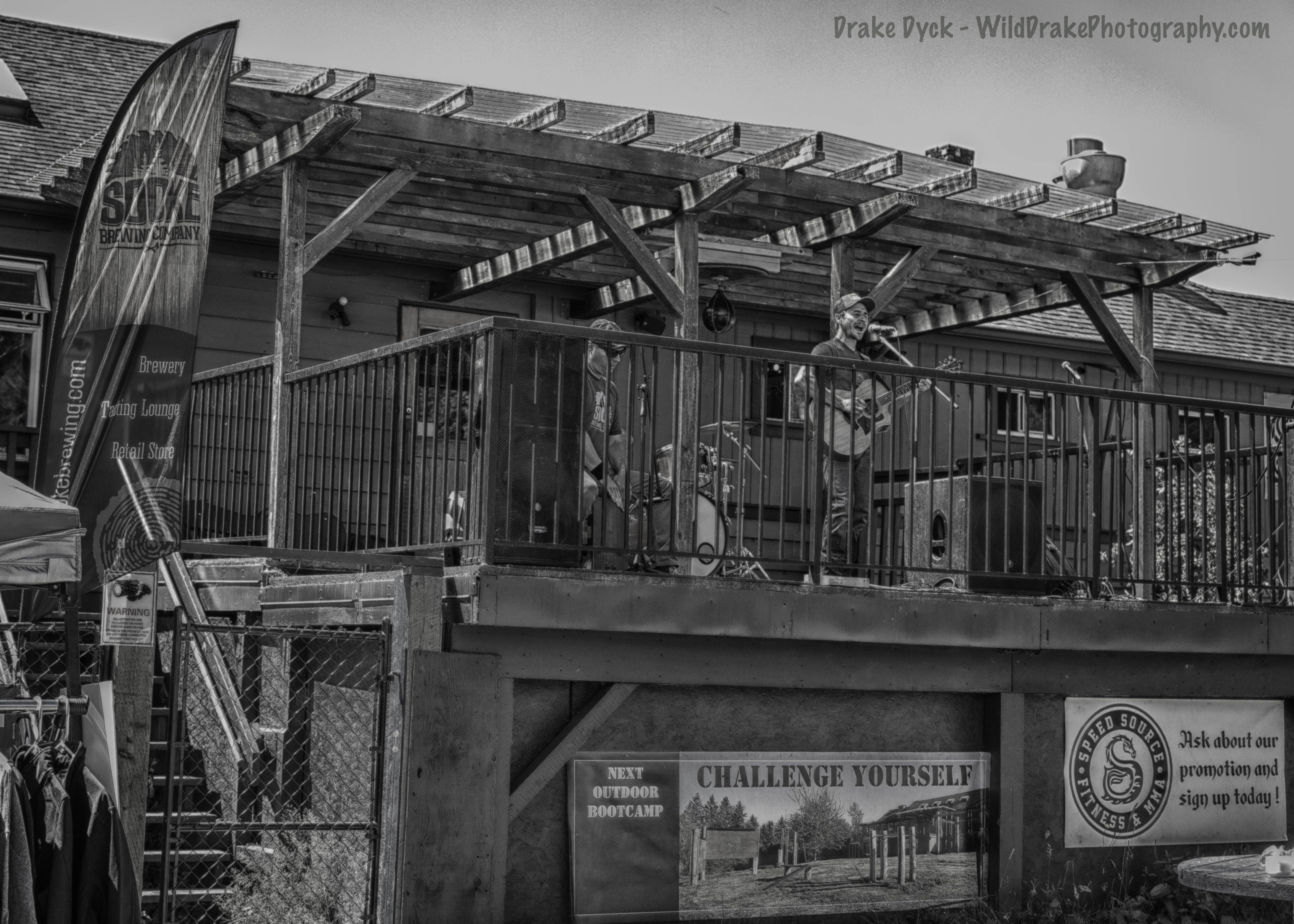 a band plays on the back deck of the fitness club